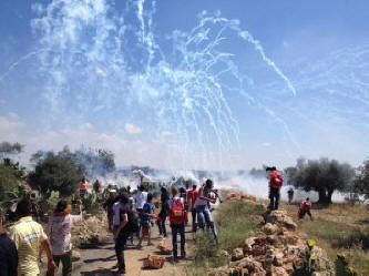 ISraeli soldiers firing hundreds of tear gas rounds at protesters in west bank village of Ni'lin during commemorating 67th anniversary of Nakba. 15-05-2015