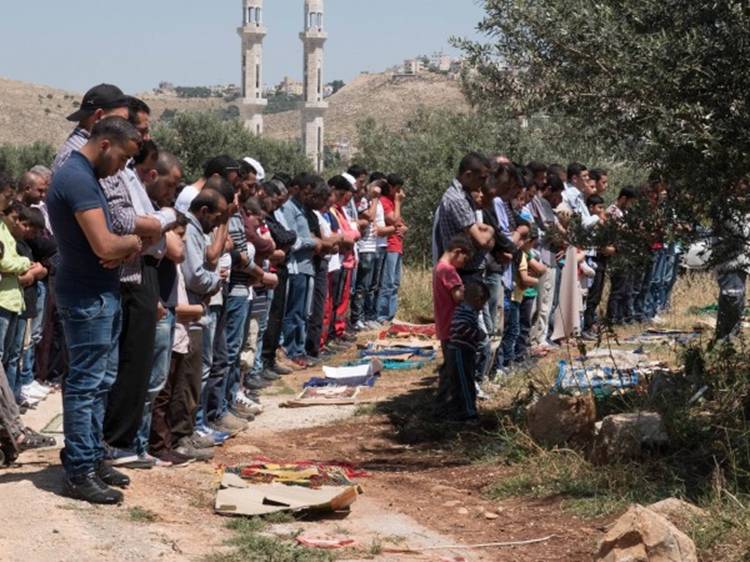 Prayers take place before the protest in Ni'lin